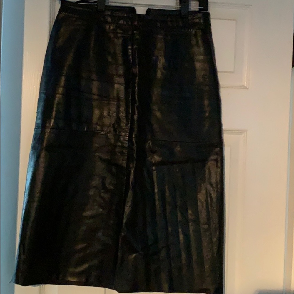 Black leather knee length skirt.